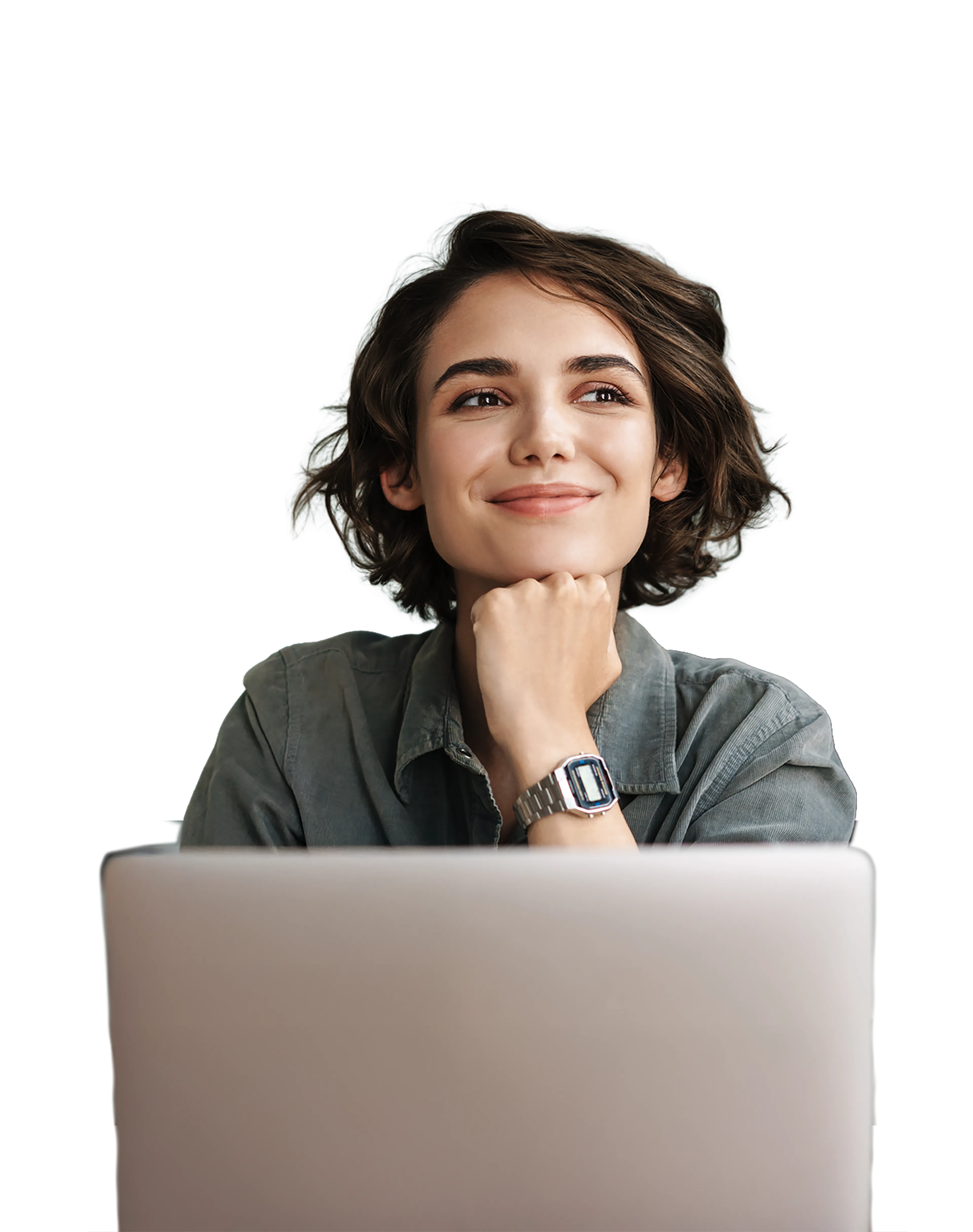Smiling woman with short hair, resting her chin on her hand, sits in front of a laptop, wearing a casual shirt and a watch.