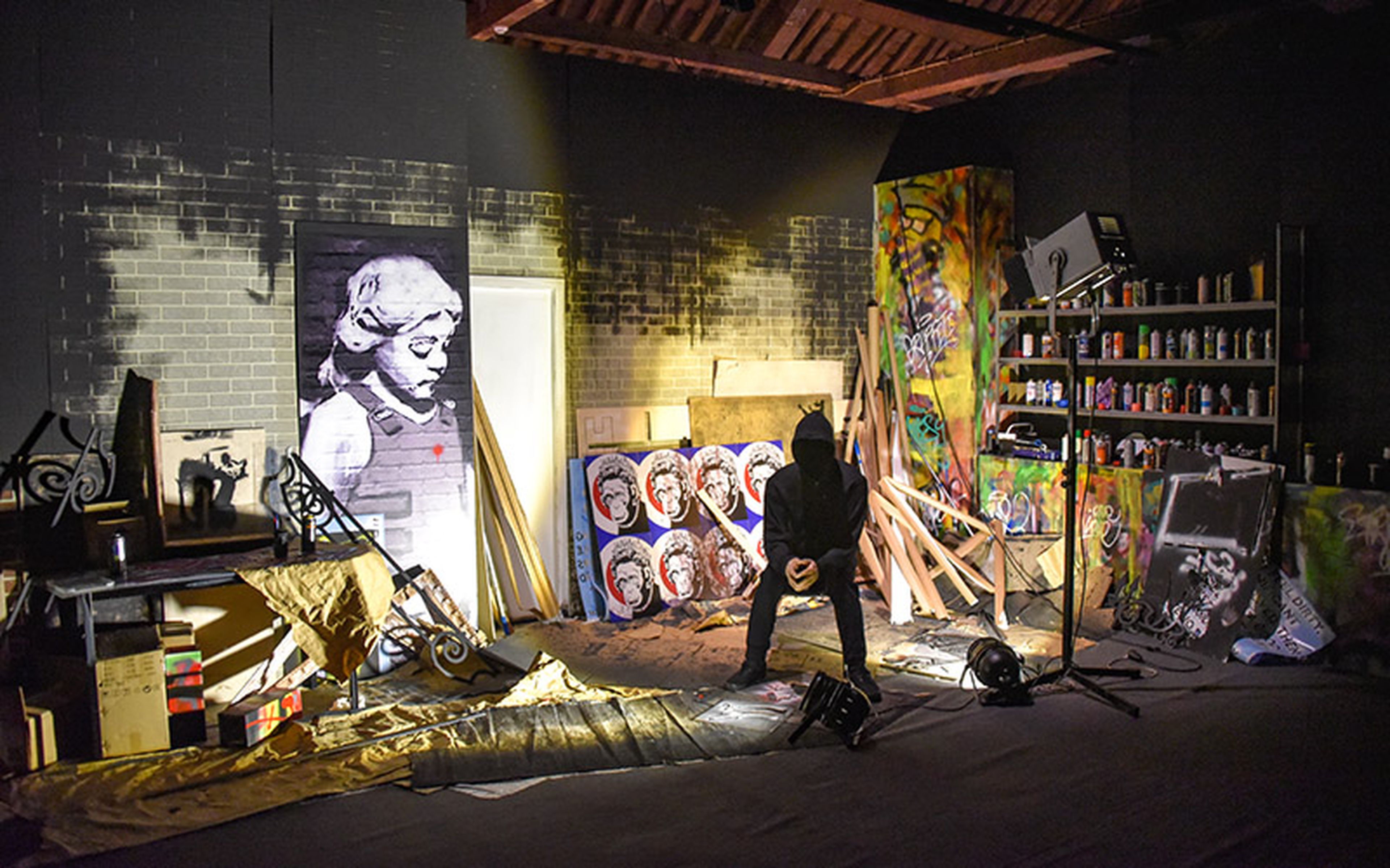The painter known as Banksy exhibited his "Genius or Vandal" works at the Cordoaria Nacional art space in Lisbon, Portugal. The identity of the world-famous graffiti artist has remained a closely guarded secret for years. (Image source: iStock. Image credit: marktucan)